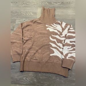 Size S. Never warn boutique brand sweater.